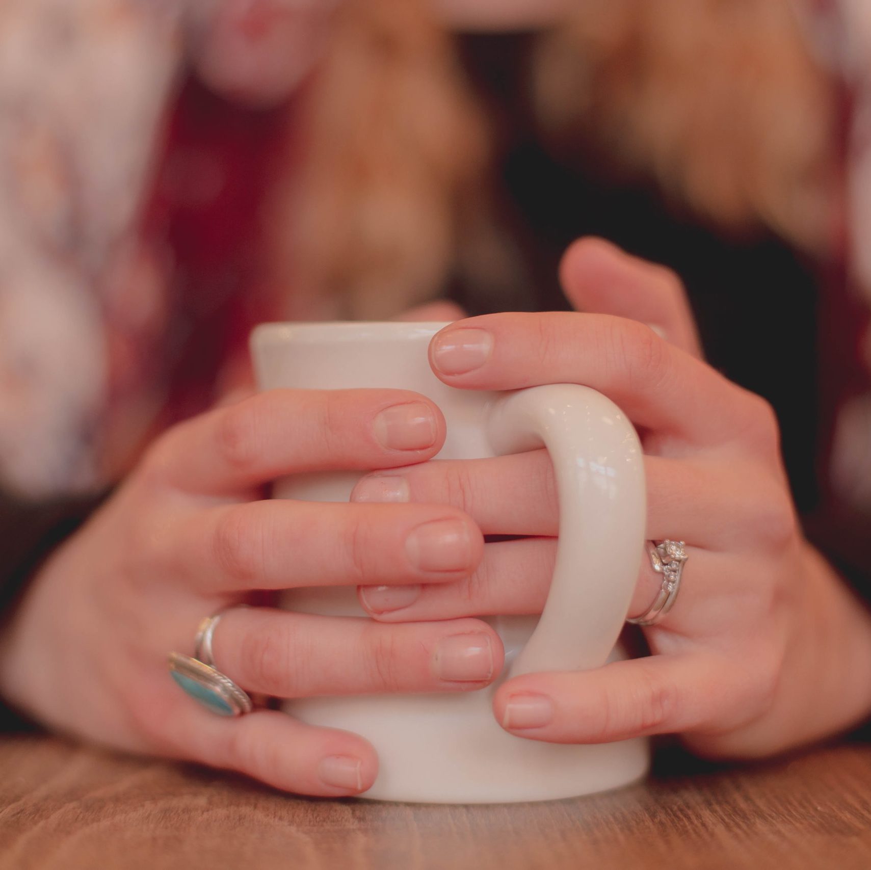 Image of woman's hands holding a mug
